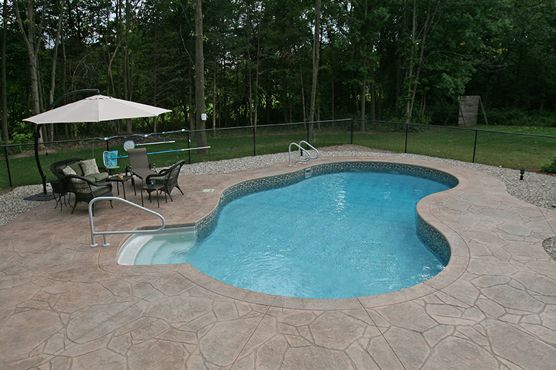 Swimming pool and stamped concrete project example 196